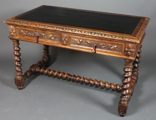 A Victorian carved oak writing table with black leather skiver  above 2 long drawers, raised on spiral turned columns with H  framed stretcher 30"h x 47"w x 27"d