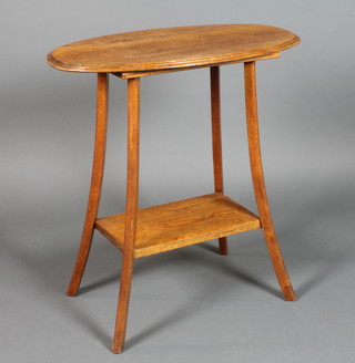 An Edardian Arts & Crafts oval oak occasional table with undertier, raised on outswept supports 28"h x 29"w x 15"d 
