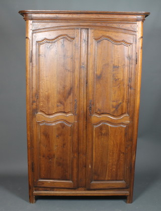 A 19th Century French elm armoire with moulded cornice  enclosed by panelled doors 81.5"h x 52"w x 21"d