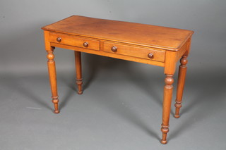 A Victorian rectangular mahogany side table fitted 2 drawers  with tore handles, raised on turned supports 28"h x 40"w x 18"d