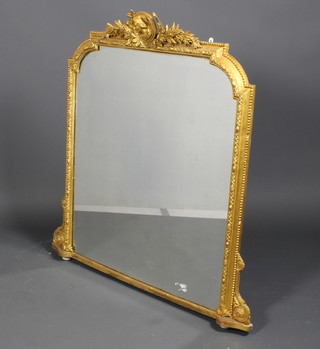 A 19th Century gilt over mantel mirror with crest portrait and laurel leaves with scrolled supports 39"