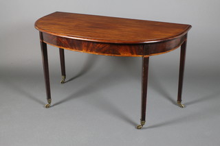 A Georgian mahogany D end section of dining table/hall table on square legs ending in brass caps and casters, 25"h x 47"w x 22"d 