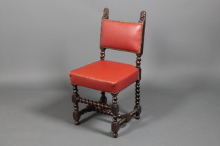 A carved oak Carolean style single dining chair with barlet twist supports and stretchers with red leatherette upholstery