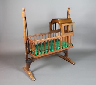 A 19th Century mahogany childs cradle, raised on a swinging stand 46"h x 39"w x 17"d 