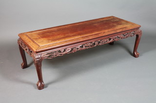 A Chinese rosewood rectangular table with pierced apron, raised on ebonised supports 16"h x 50"w x 20"d 
