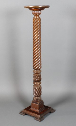 A Victorian carved mahogany bedpost torchere 49"h x 11" diam. 