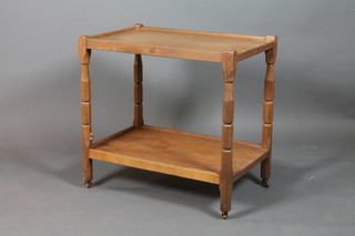 A Beaver Man oak 2 tier tea trolley on turned supports, carved a beaver 29"h x 30"w x 19"d 
