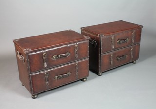 A pair of leather 2 drawer chests in the form of suitcases, raised on turned supports 20"h x 27 1/2"w x 16"d 