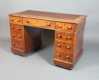 A Victorian mahogany pedestal desk with inset writing surface above 1 long and 8 short drawers with tore handles 29"h x 47"w x 23"d