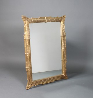 A plate mirror contained in a decorative gilt frame 44" x 31" 