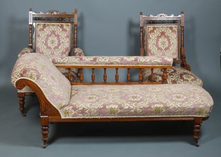 An Edwardian carved walnut chaise longue on ring turned legs, 2 ensuite chairs, 1 with arms 