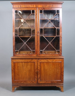 A Georgian mahogany bookcase on cabinet, the upper section with moulded cornice, the interior fitted shelves above 3 long drawers, enclosed by astragal glazed panelled doors, the base enclosed by panelled doors, raised on splayed feet 83"h x 49"w x 18"d 