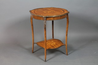 A French circular inlaid mahogany 2 tier occasional table, raised on cabriole supports with gilt metal mounts 27"h x 22" diam. 