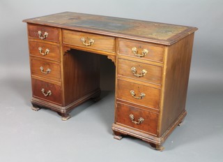 An Edwardian Chippendale style mahogany pedestal desk with green skiver, fitted 1 long drawer flanked by 8 short drawers, raised on bracket feet 30"h x 48"w x 21"