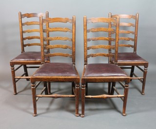 A set of 4 ladder back dining chairs with drop in seats, raised on club supports 