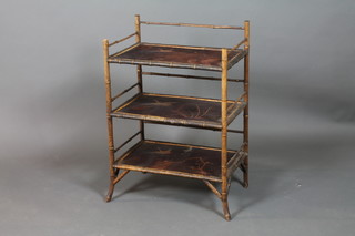 A rectangular 3 tier bamboo what-not with lacquered panels decorated birds 32"h x 22 1/2"w x 15"d 