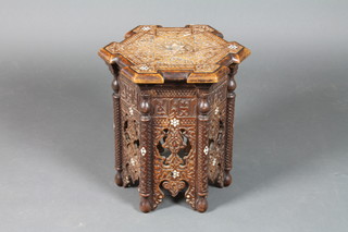 An octagonal carved and pierced Moorish occasional table inlaid mother of pearl 16"h x 14"w x 13"d 
