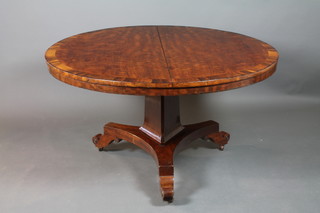 A William IV circular mahogany snap top breakfast table with crossbanded top, raised on a chamfered column and triform base 29"h x 51 1/2" diam. 