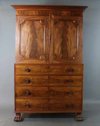 A William IV mahogany linen press, the upper section with moulded cornice, fitted 2 trays enclosed by panelled doors, the base fitted 4 long drawers with tore handles, raised on paw feet 87" x 57"w x 22"d