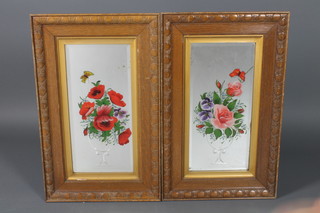 A pair of Victorian rectangular bevelled plate wall mirrors, etched and painted vases of flowers contained in carved oak frames, the reverse with Antique Road Show labels 32 1/2" x 20"