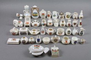 A large quantity of crested novelty vessels, pots, vases etc