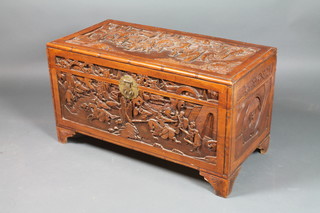 A Chinese camphor wood coffer with hinged lid, heavily carved throughout, on bracket feet 22"h x 40"w x 20"d  