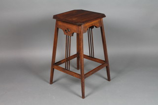An Arts & Crafts square oak occasional table with canted corners raised on outswept supports 28"h x 15 1/2" x 16"