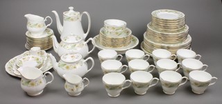 A Duchess green sleeves design 83 piece tea and dinner service comprising coffee pot, teapot, small teapot, 2 milk jugs, 1 cream jug, 11 tea cups, 2 slop bowls, sugar bowl, a deep bowl, 11 dessert bowls, 10 dinner plates, 2 large serving plates, 10 side plates, 12 saucers, 1 egg cup, 3 small dishes, an oval dish, a round dish, 12 side plates