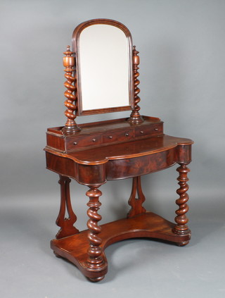 A Victorian mahogany dressing table with swing mirror, fitted 3 glove drawers above a bow front drawer, raised on spiral turned supports with undertier, 61"h x 36"w x 21"d