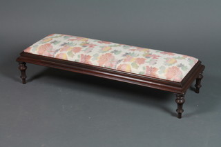 A Victorian style rectangular mahogany footstool with upholstered drop in seat, raised on turned and fluted supports, leg f and r, 8"h x 36"w x 13"d 
