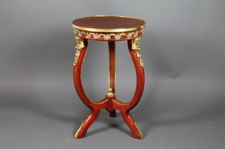 A circular Empire style occasional table, raised on shaped supports with gilt metal mounts throughout, 31"h x 19 1/2"diam.