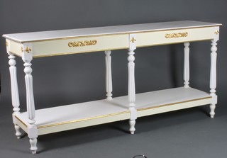 A Louis style white painted rectangular 2 tier serving table, raised on turned and reeded supports 35"h x 74"w x 20"d