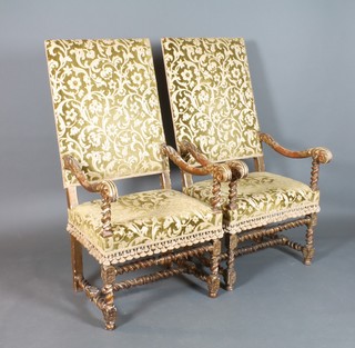 A pair of French Carolean style carved wood and gesso open arm chairs, the seats and backs upholstered in sculptured dralon, raised on spiral turned supports with H framed stretchers 