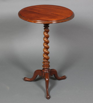 A Victorian circular mahogany wine table, raised on a spiral turned column and tripod base 27"h x 18"diam.