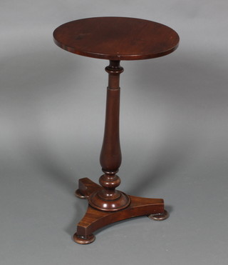 A William IV circular mahogany occasional table raised on a turned column with triform base 30"h x 17 1/2" diam.