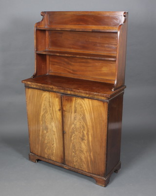 A Georgian mahogany chiffonier with associated raised back fitted 2 shelves above a double cupboard enclosed by panelled doors 64"h x 39"w x 15"d 