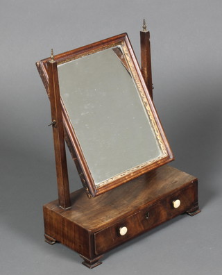 An 18th Century rectangular plate toilet mirror contained in a mahogany swing frame, the base fitted 1 long drawer, on ogee bracket feet 17"h x 12 1/2"w x 6"d