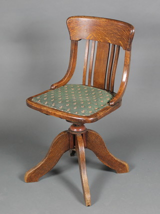 A Victorian tub back swivel office chair on tripod supports
