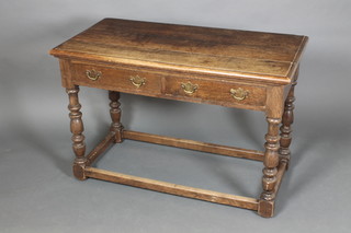 A Victorian rectangular oak side table fitted 2 drawers raised on a turned column united by an H framed stretcher 30"h x 45"w x 22"d