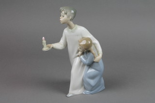 A Lladro style group of 2 children "At bed time" 9"