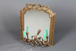 A 19th Century arched plate mirror contained in a gilt plaster frame, the base with a 3 light candle sconce 23" x 18" 