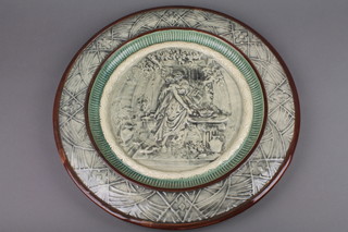 A 19th Century Continental wall plate decorated with a fete galante scene 17" 
