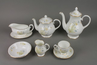 A Marlborough china dinner and tea service decorated with spring flowers comprising 12 cups, 12 saucers, 12 side plates, 12 dessert plates, 12 dinner plates, 12 dessert bowls, teapot, coffee pot, 4 tureens and covers, 2 sauce boats and stands, a cream jug and sugar bowl and 2 oval meat plates