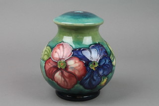 A Moorcroft baluster table lamp, the green and blue ground decorated clematis impressed marks 7"