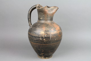 A Greek companion jug with simple handle of tapered form 14"