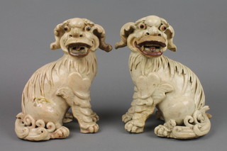 A pair of 18th Century cream glazed figures of Dogs of Fo 9", f, 