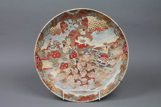 A Japanese Satsuma dish decorated with Samurai within a geometric border 14" 