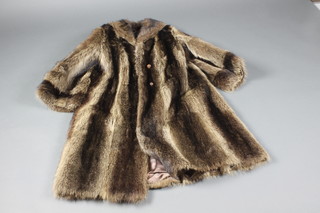 A ladies black and silver full length fur coat by Simpsons