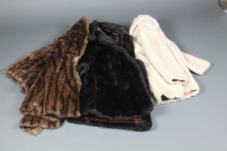 A lady's brown fur coat, a Bickle black simulated fur coat and a lady's Marno white simulated mink fur coat 