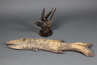 John Redfern, a wooden sculpture, 16" together with a carved wooden plaque of a fish 44"